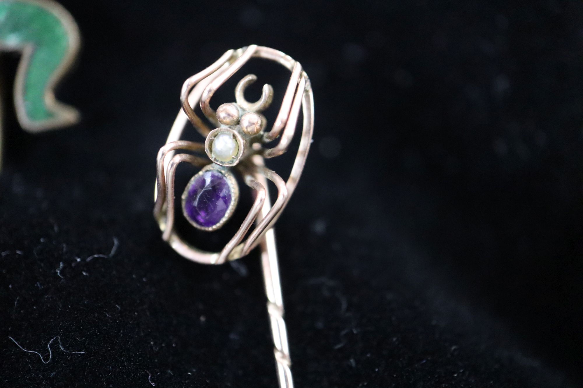 Twenty assorted Victorian and later mainly yellow metal and gem set stick pins